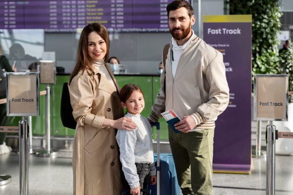 medium-shot-smiley-family-traveling_23-2149272175